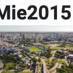an aerial view of a city with a soccer field